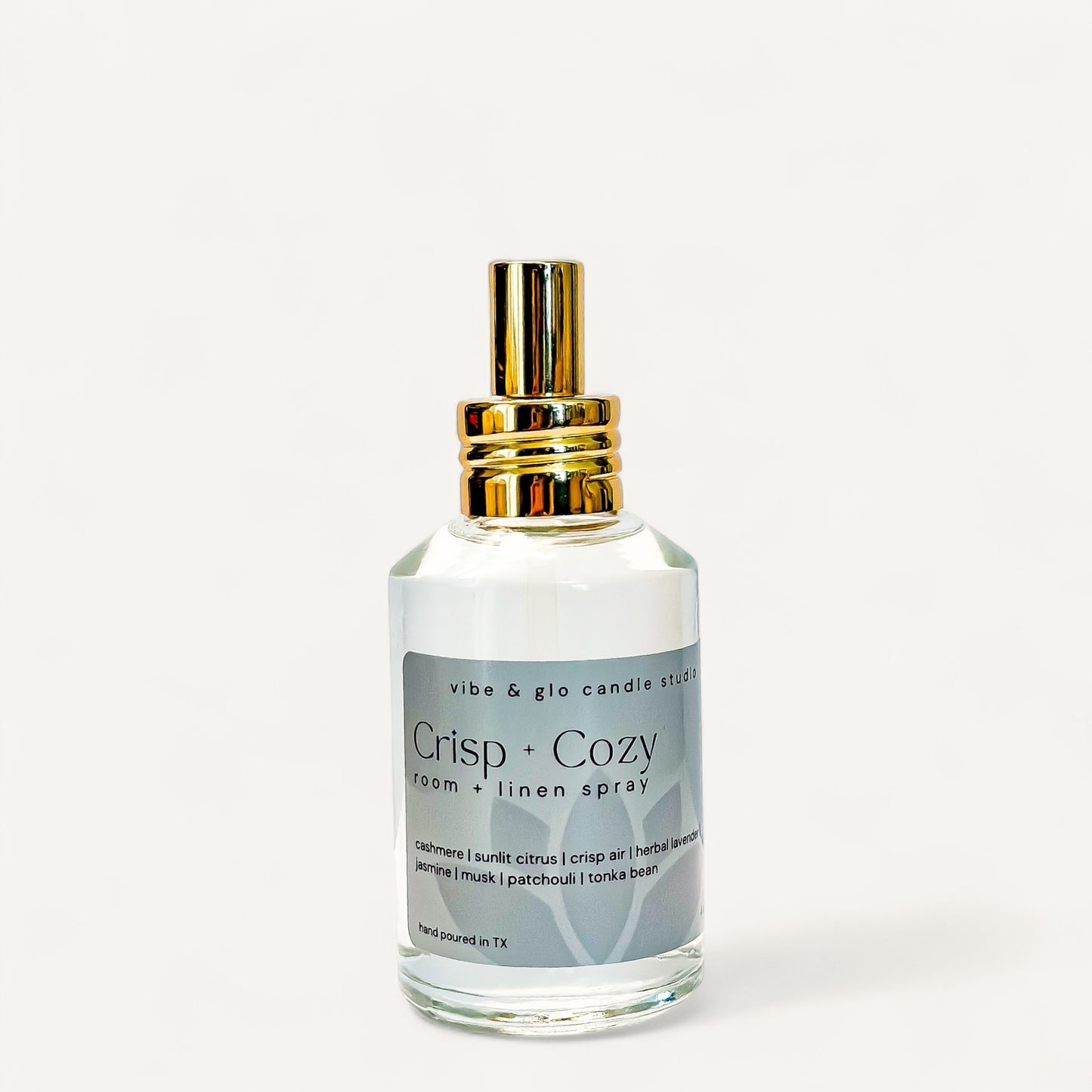 Crisp + Cozy Room & Linen Spray bottle featuring cashmere, citrus, and lavender fragrance.