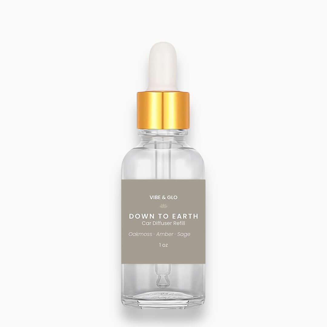 Clear bottle with gold cap and gray label on a white background