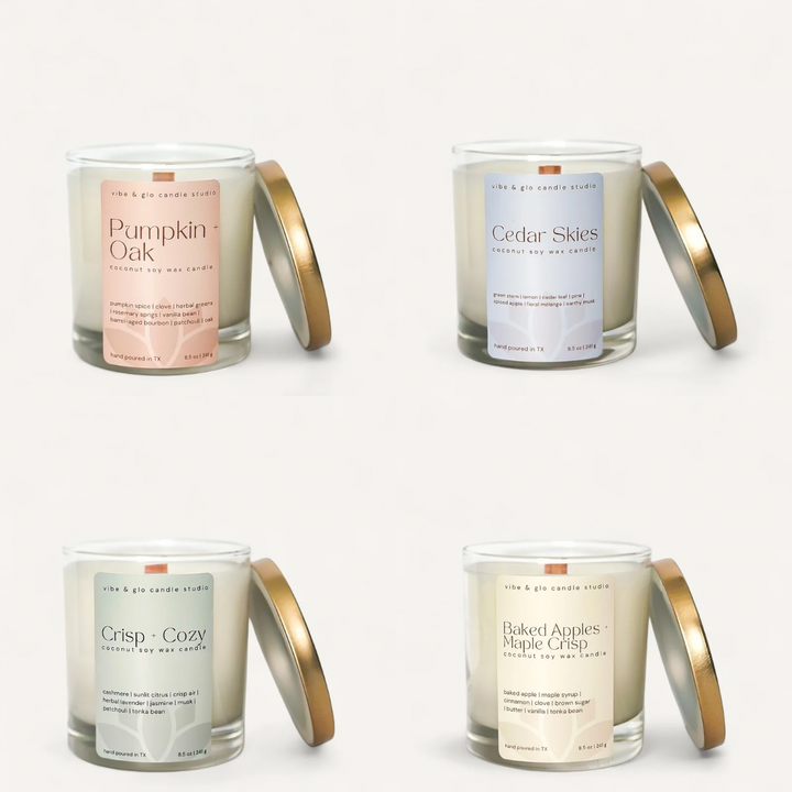 Four scented candles with labels on a white background