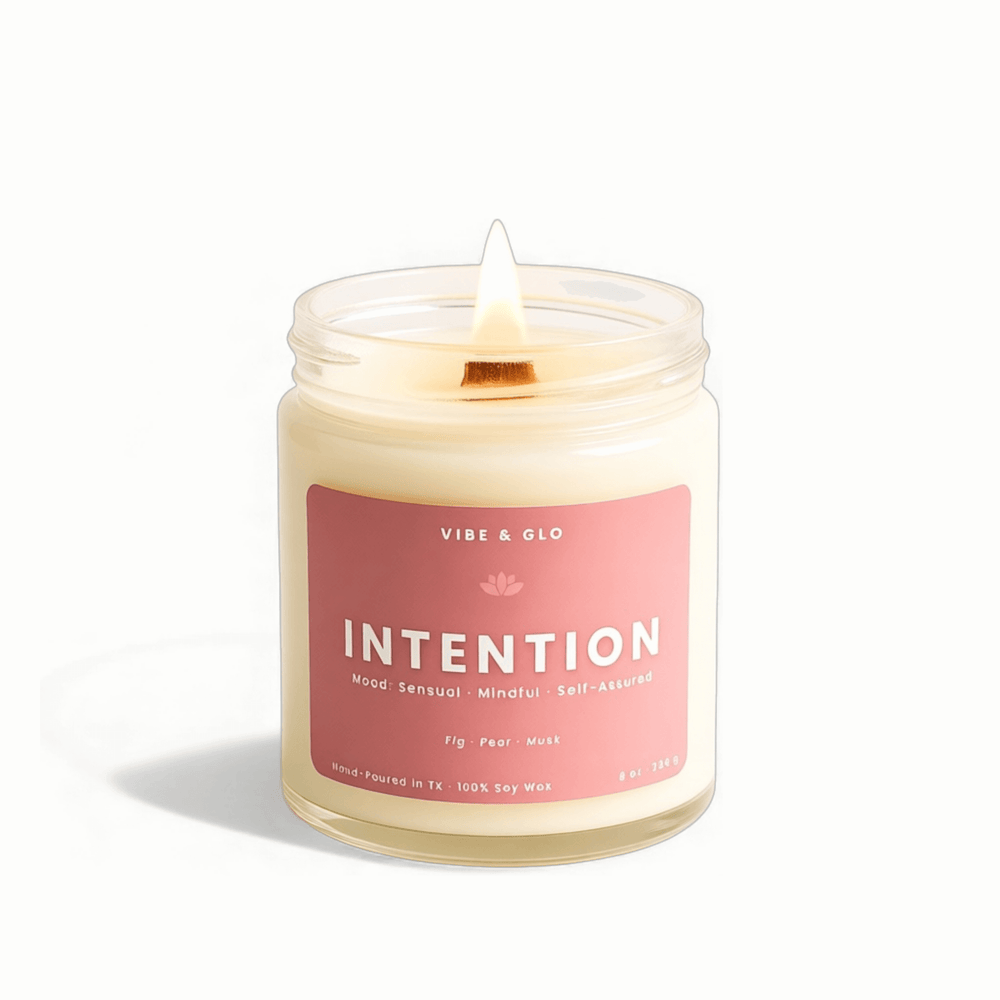 Candle with a pink label reading 'Intention' on a white background