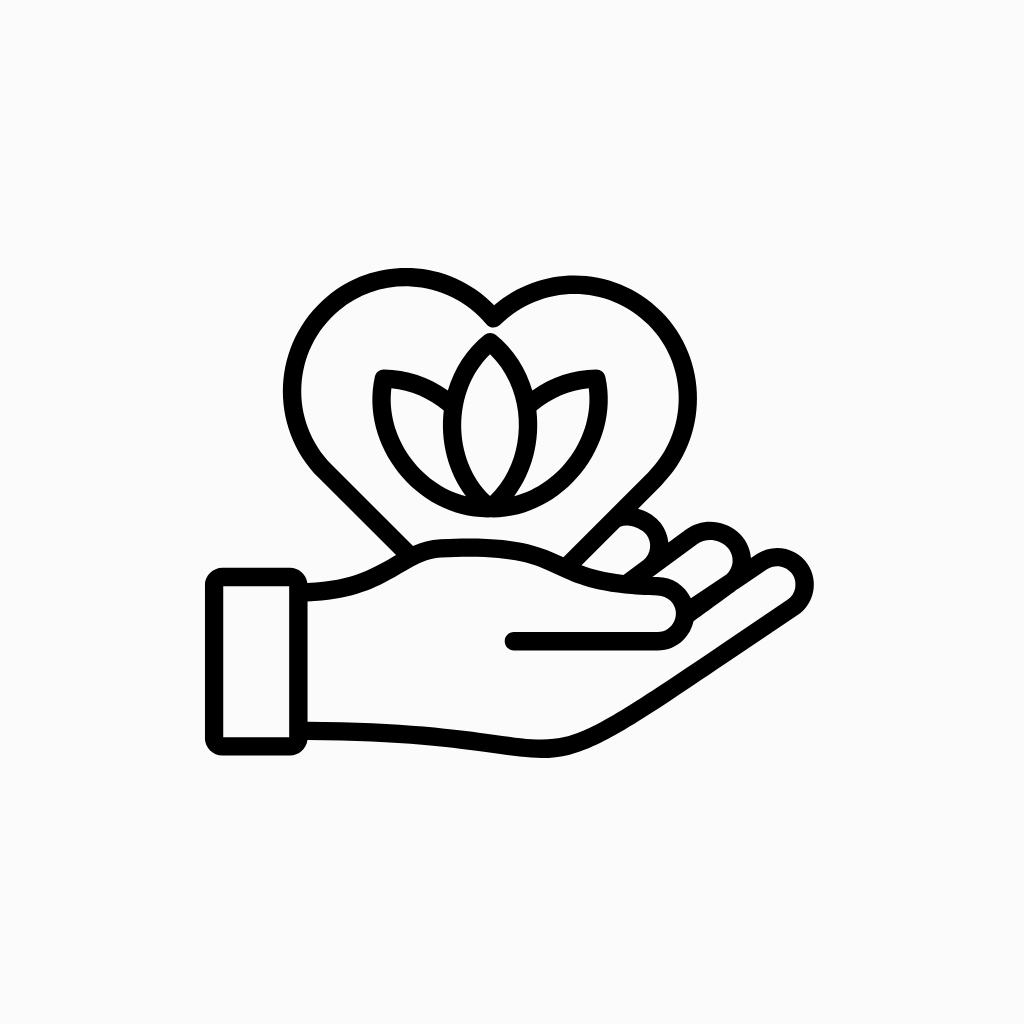 Clean black line icon showing a hand holding a heart with a lotus flower inside, representing self-care and wellness support.