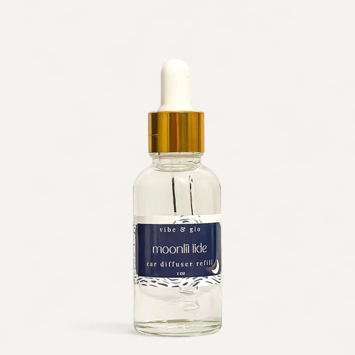 1 oz Car Diffuser Refill Bottle by Vibe & Glo, featuring a dropper for easy use, scent 'Moonlit Tide'.