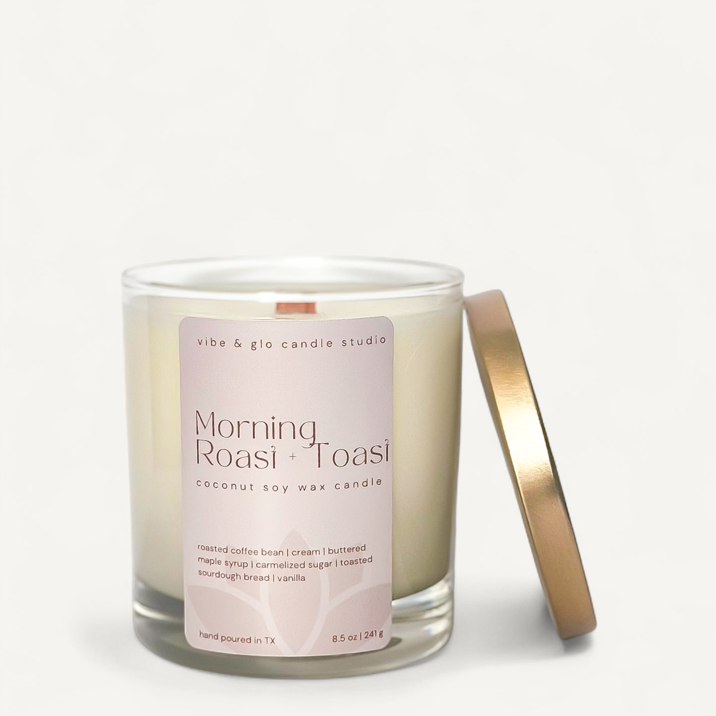 Morning Roast + Toast candle in glass jar with gold lid, featuring scents of coffee and toasted vanilla.