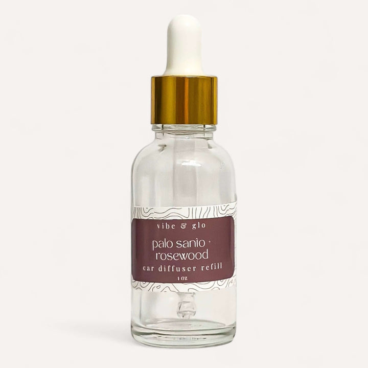 1 oz car diffuser refill bottle featuring palo santo rosewood scent from Vibe & Glo.
