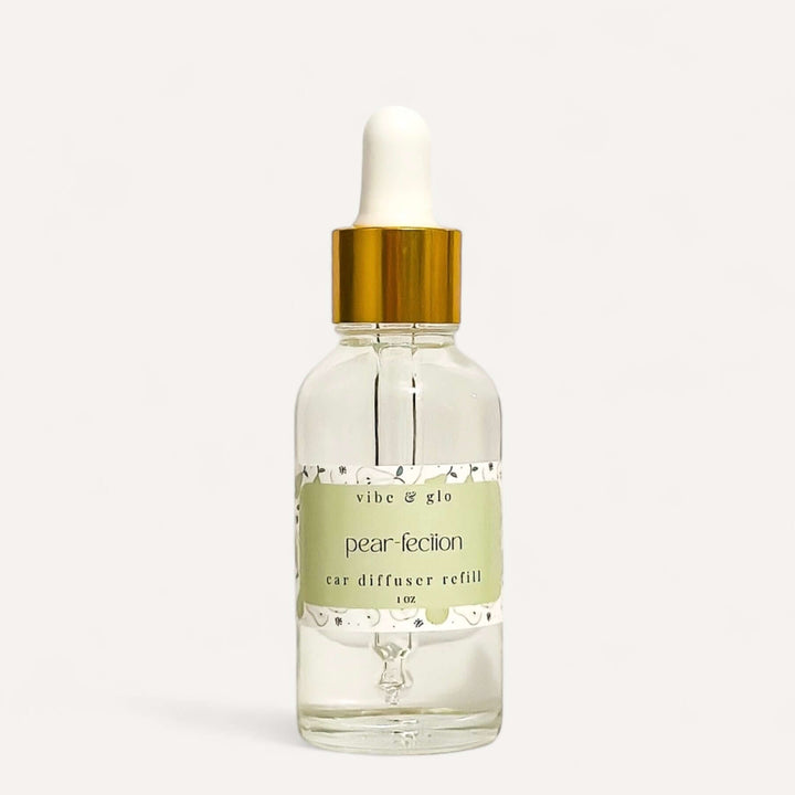 Vibe & Glo 1 oz pear-fection car diffuser refill bottle with dropper for a refreshing scent in your car.