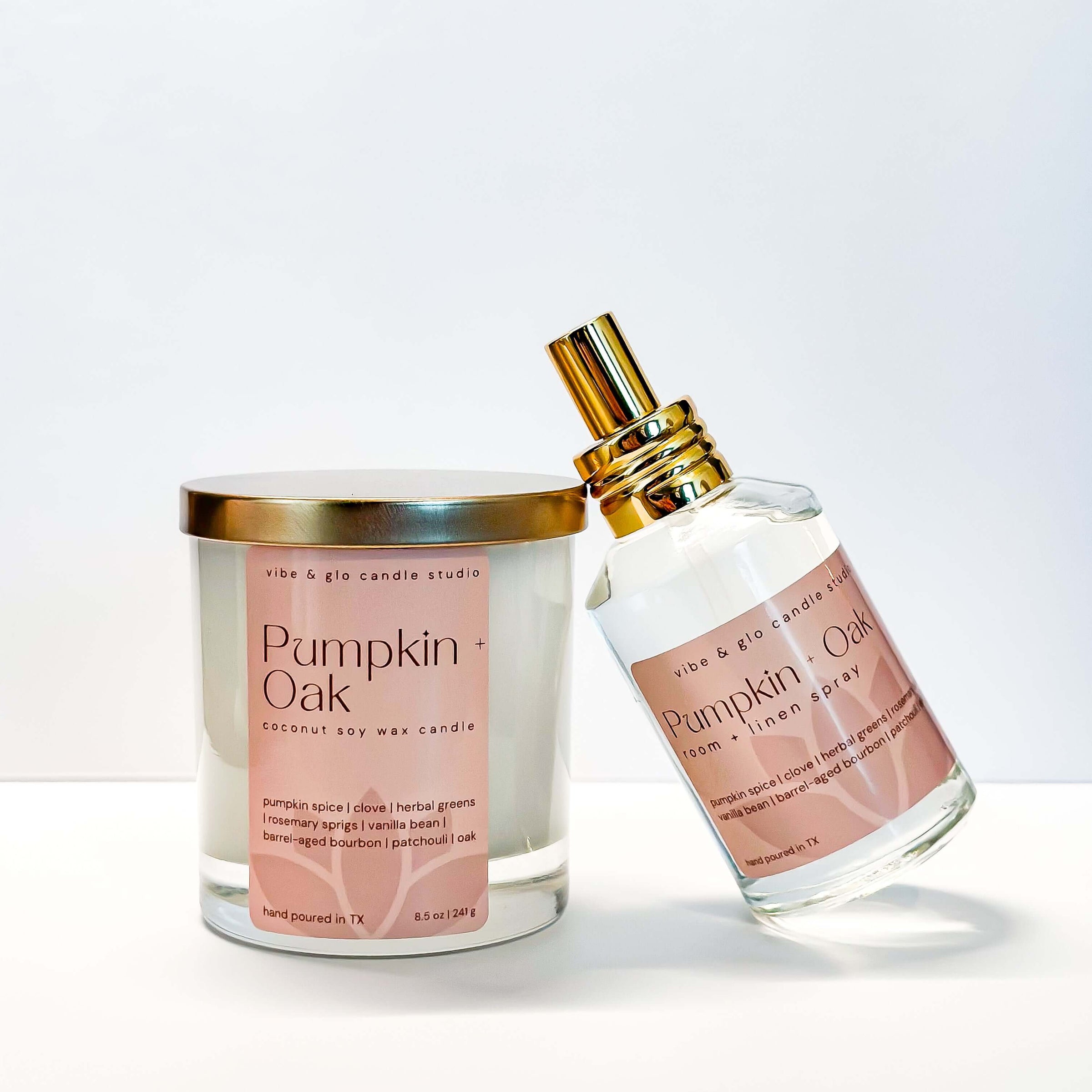Pumpkin Oak candle and perfume bottle by vibe & glo candle studio on a white background