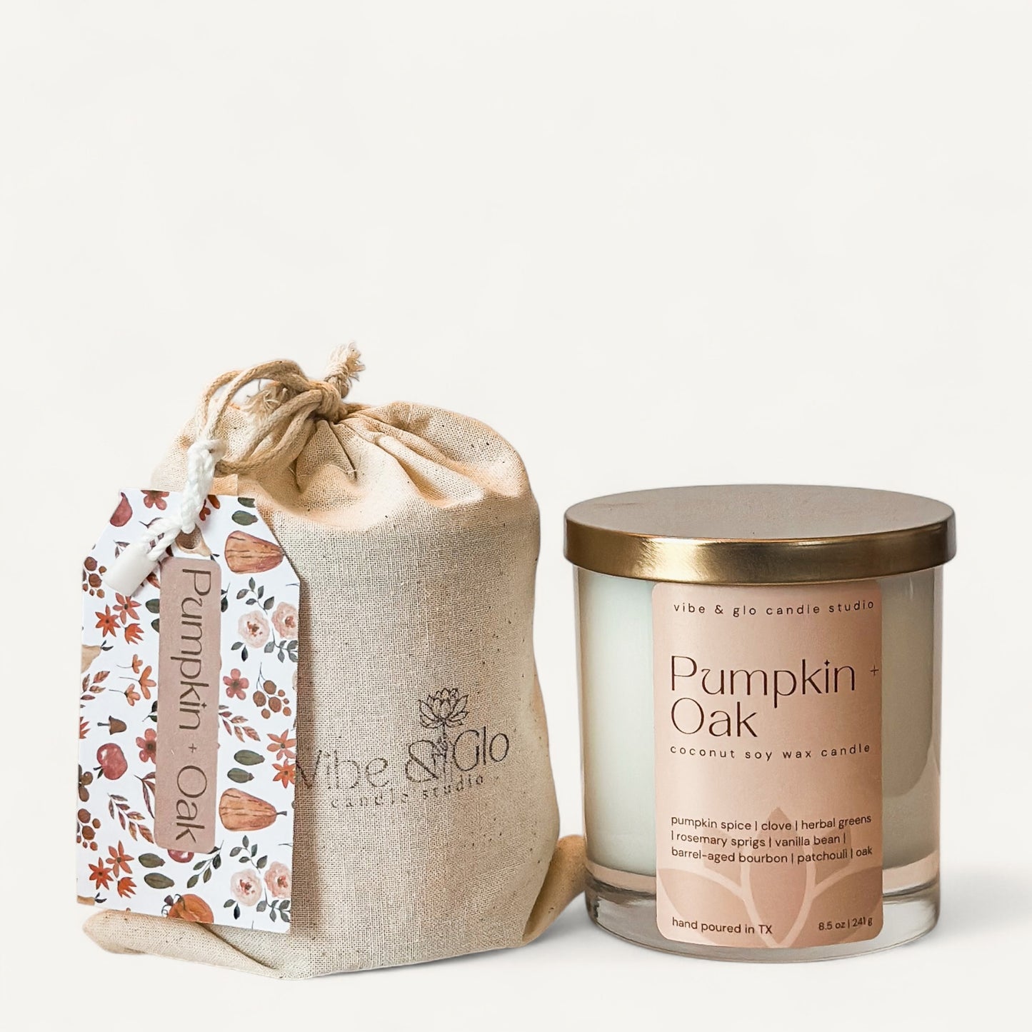 Pumpkin + Oak candle in a chic jar with natural packaging, featuring scents of pumpkin spice, clove, and oak.