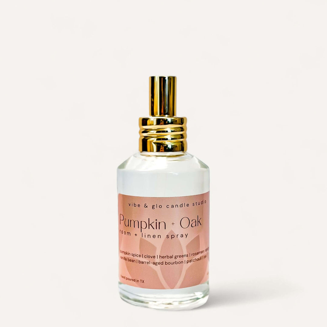 Pumpkin + Oak Room & Linen Spray bottle with warm fall fragrance of pumpkin spice and bourbon.