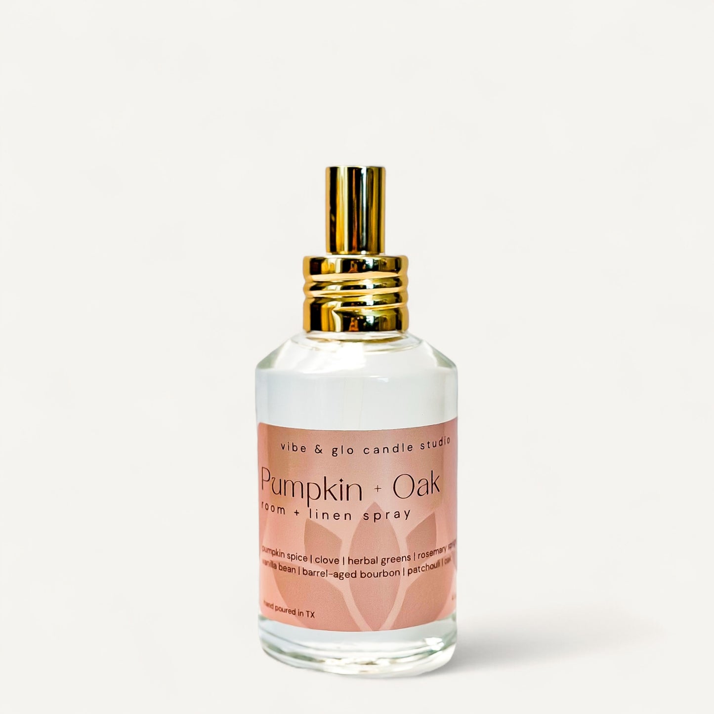 Pumpkin + Oak Room & Linen Spray bottle with warm fall fragrance of pumpkin spice and bourbon.