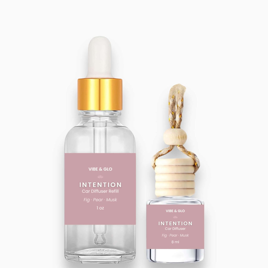 Vibe & Glo Intention car diffuser refill bottle and car diffuser on a white background