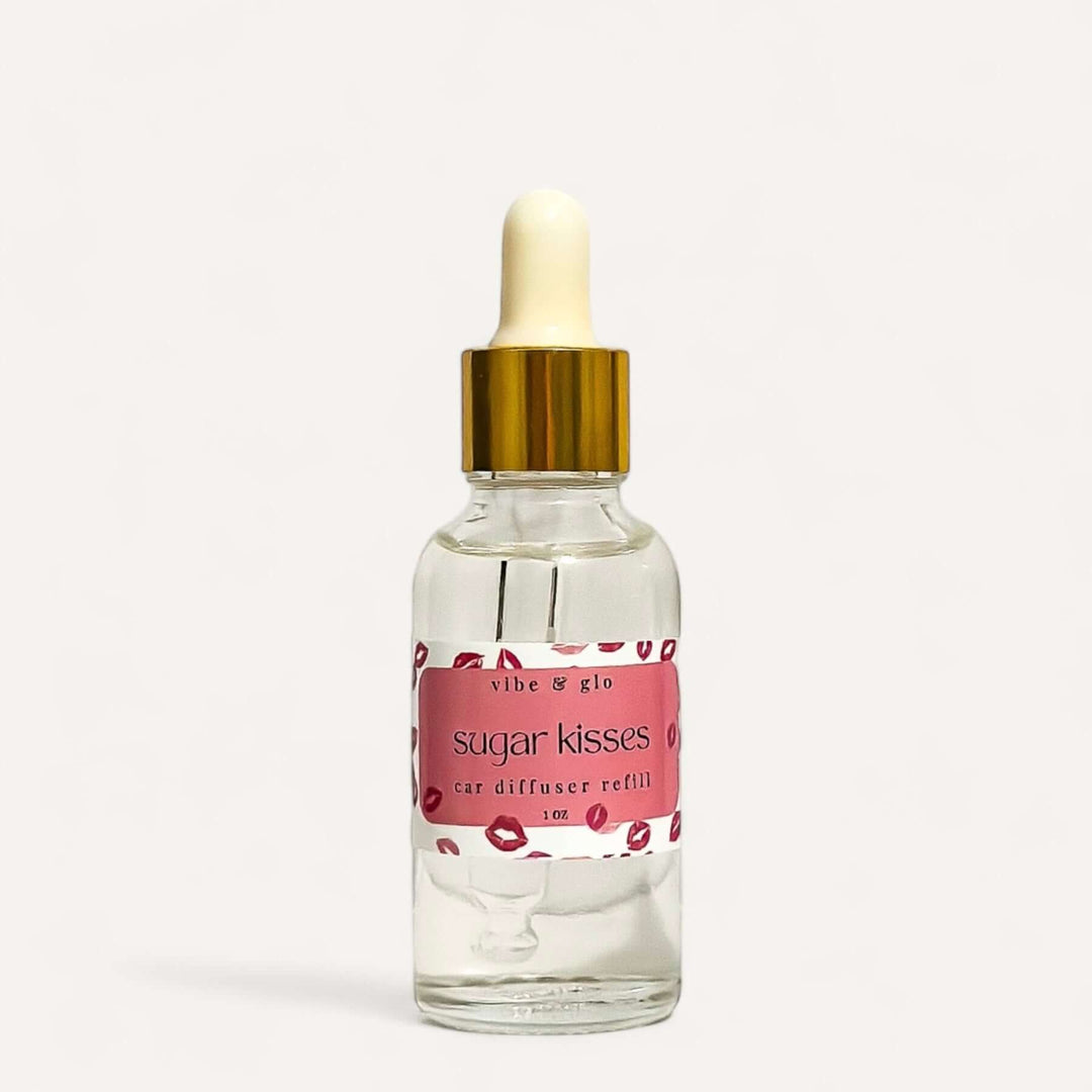 1 oz Car Diffuser Refill Bottle labeled 'Sugar Kisses' by Vibe & Glo with a dropper cap.