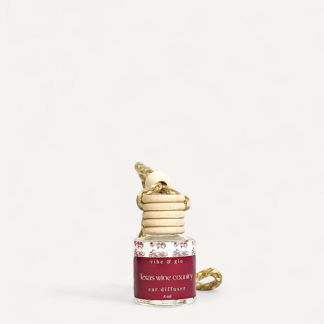 Texas Wine Country refillable car diffuser with elegant wooden cap for long-lasting fragrance.