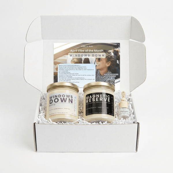 Windows Down Vibe of the Month candle subscription box by Vibe & Glo with two candles, car diffuser, and insert card in clean white packaging